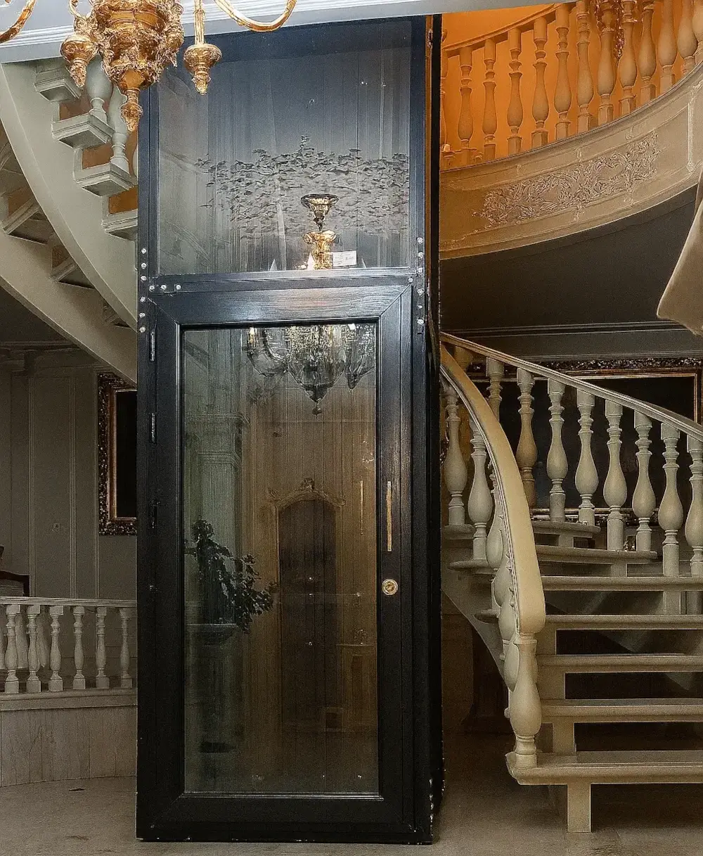 Luxury glass home lift in a duplex interior